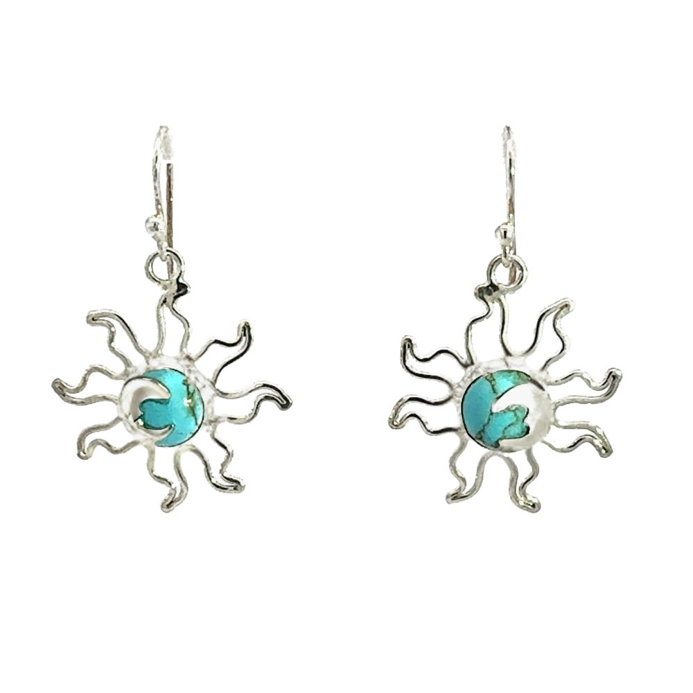 Sun-shaped earrings with turquoise centers on a white background