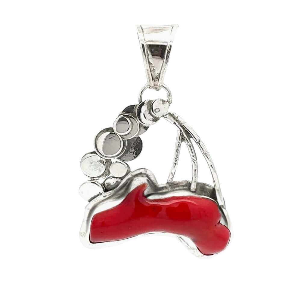 Silver pendant with red coral on a white background