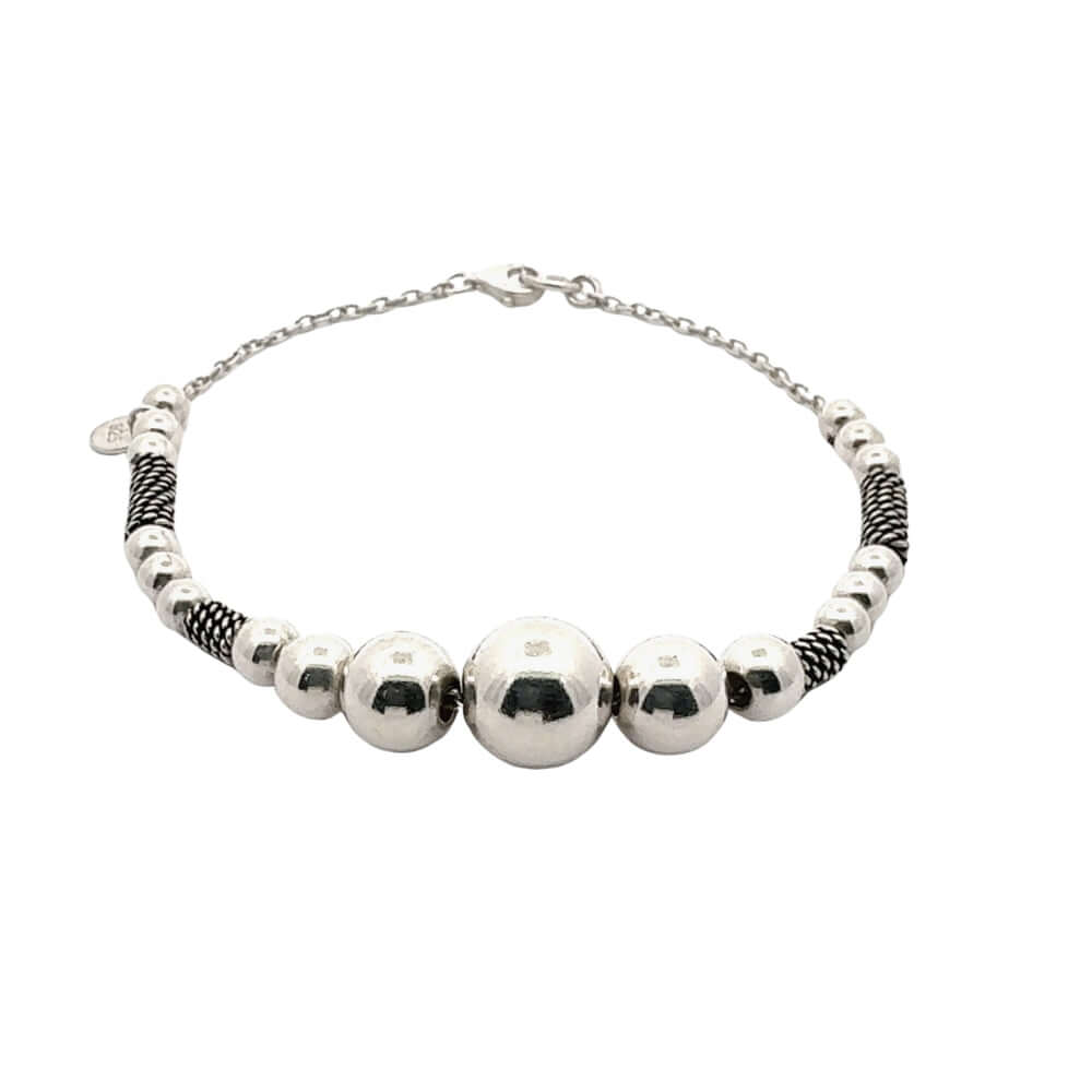 Silver beaded bracelet on a white background