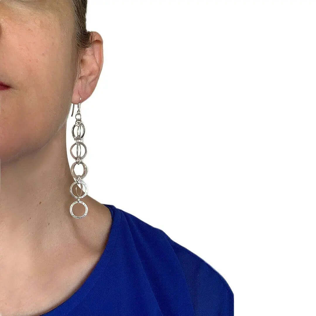 Long Hammered Circles Silver Earrings with model - Nueve Sterling