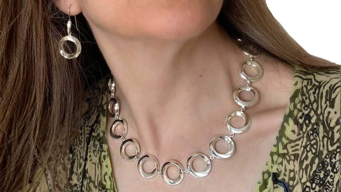 Authentic Taxco silver necklace and earrings with model