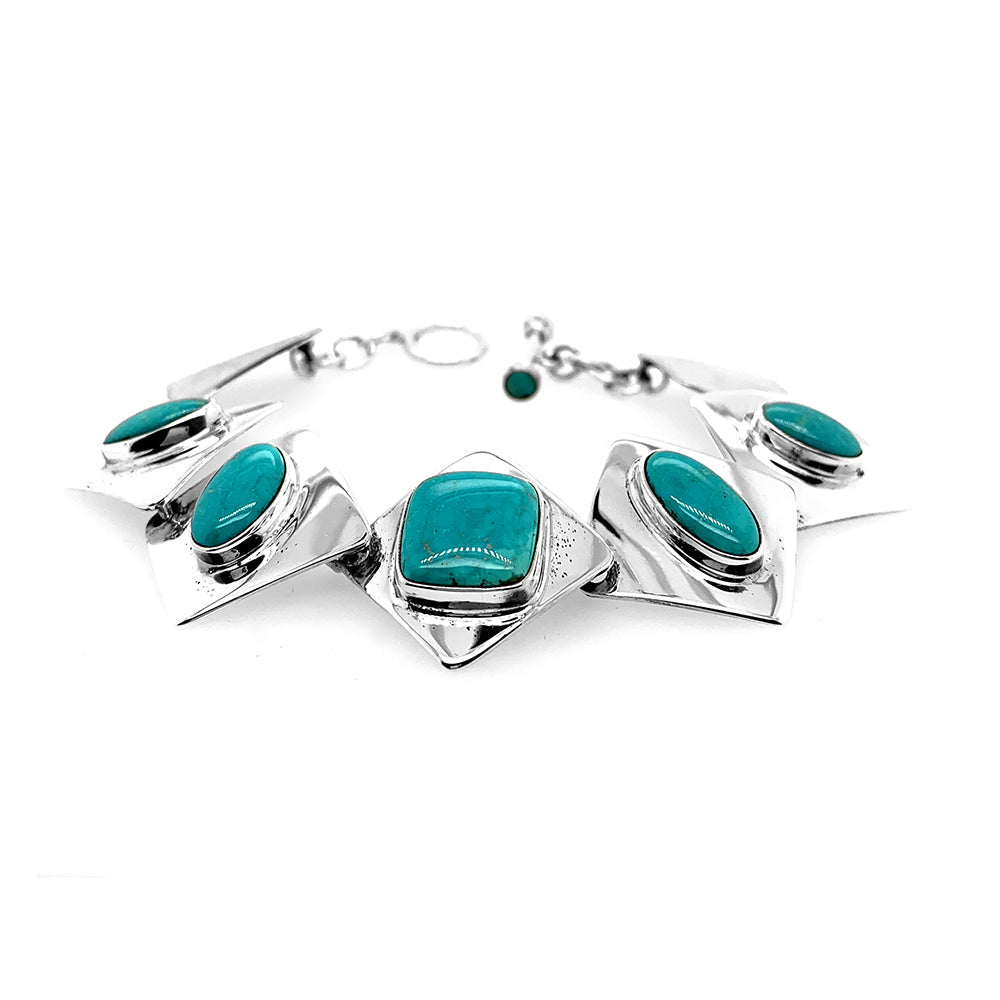 Nickel-free .925 and .950 silver stone bracelets personally curated from certified Taxco workshops. Hand-forged artisan links featuring unique natural gemstones.