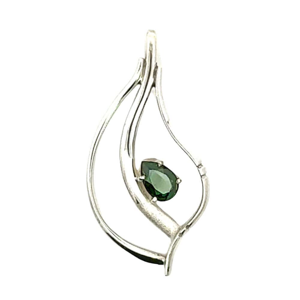 Hand-detailed 925 Taxco silver pendant featuring an organic leaf-inspired openwork design and a teardrop-shaped green peridot gemstone.
