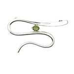 Front view of a hand-detailed .925 sterling silver pendant featuring a fluid, wavy design and a center-set green tourmaline.