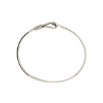 Top view of silver bracelet on a white background