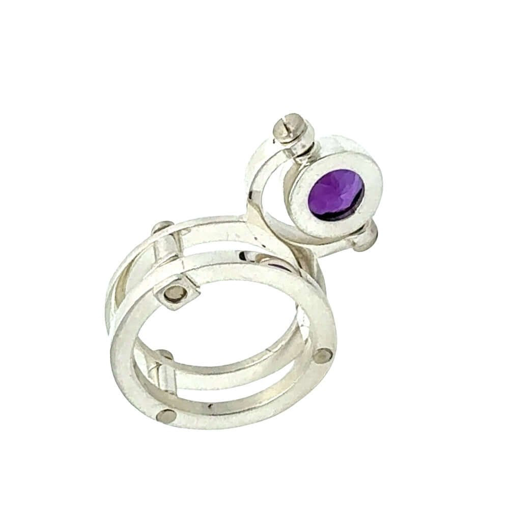 950 Silver ring with a purple gemstone on a white background