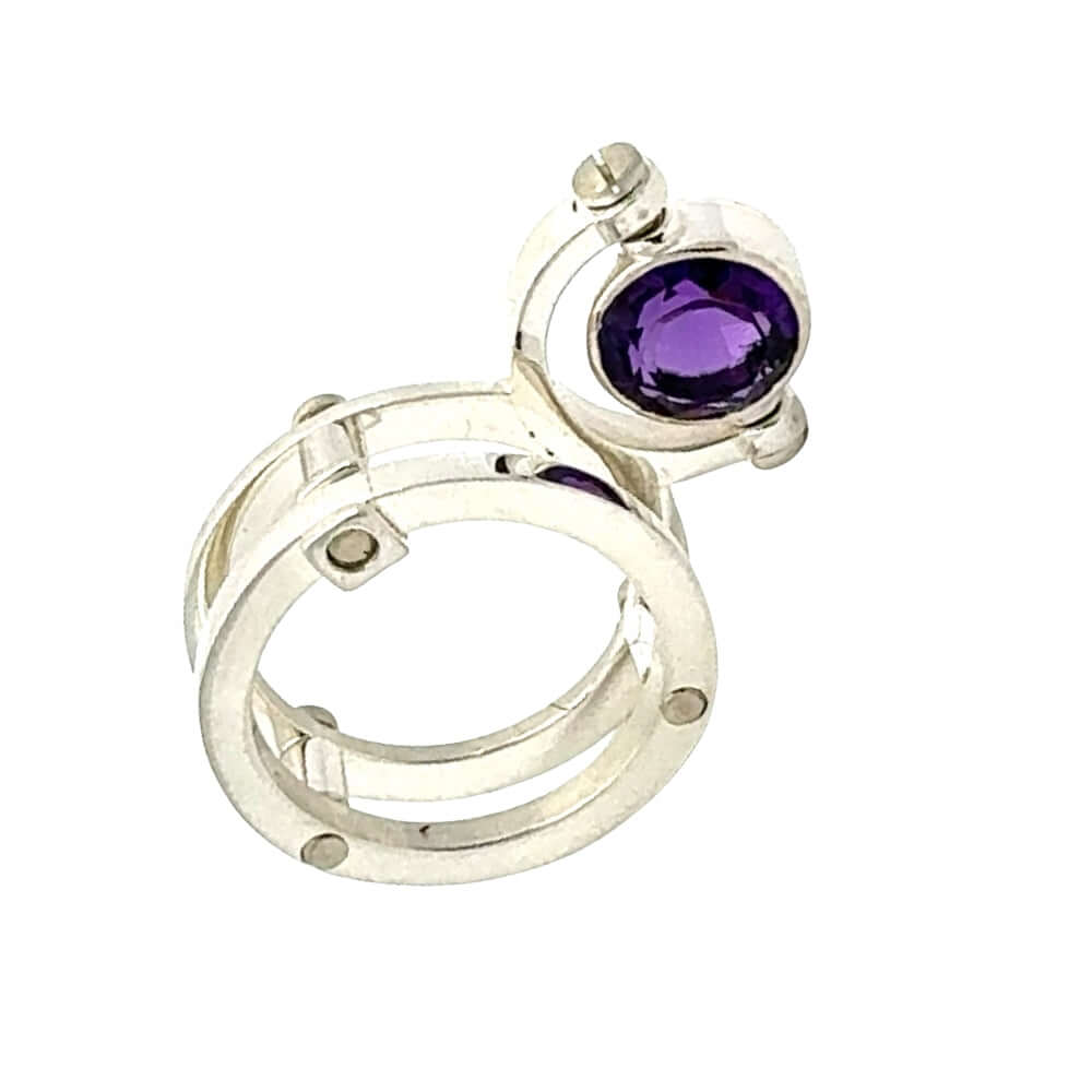 950 Silver ring with a purple gemstone on a white background