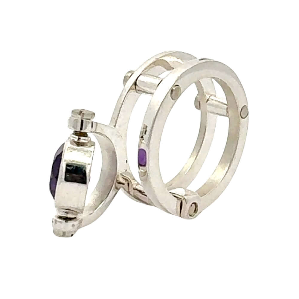 950 Silver Taxco ring with purple gemstones on a white background