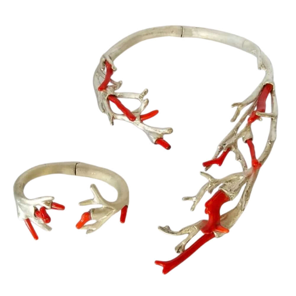 950 Silver and red coral branch-like jewelry piece on a white background