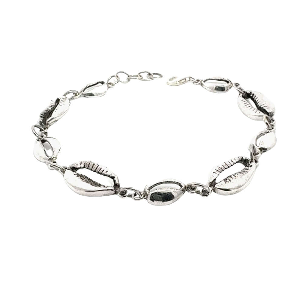 Silver bracelet with shell-like links on a white background