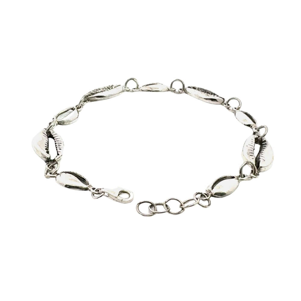 Silver bracelet with shell-like links on a white background