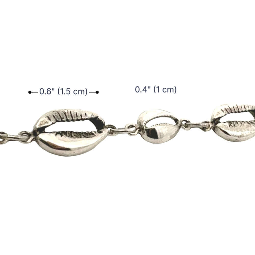 Silver bracelet with shell-like links on a white background with measurements