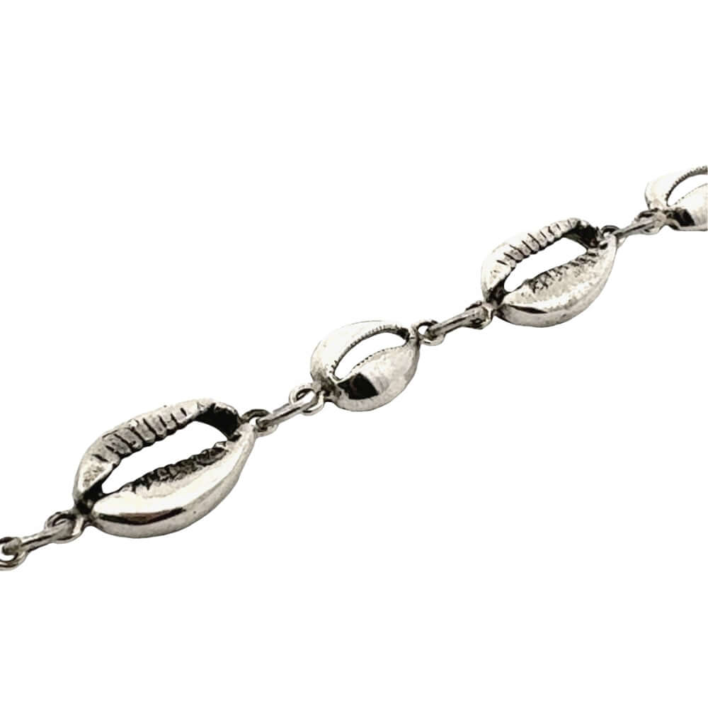 Silver bracelet with shell-like links on a white background