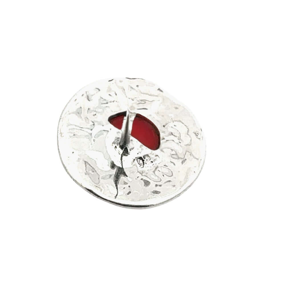 Back of a silver earring with red coral on a white background