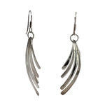 Pair of silver leaf-shaped earrings on a white background