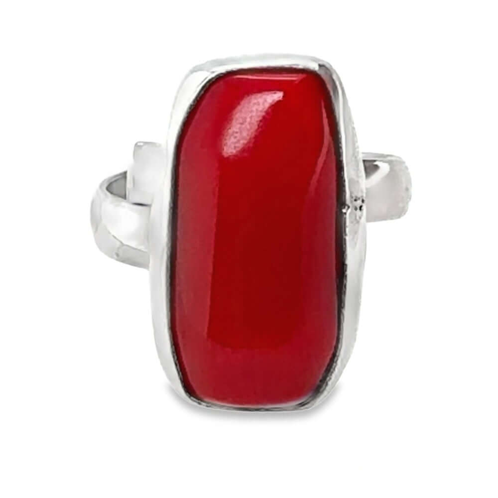 Ring with a red coral and 950 silver band on a white background