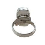 Silver ring with a unique design on a white background