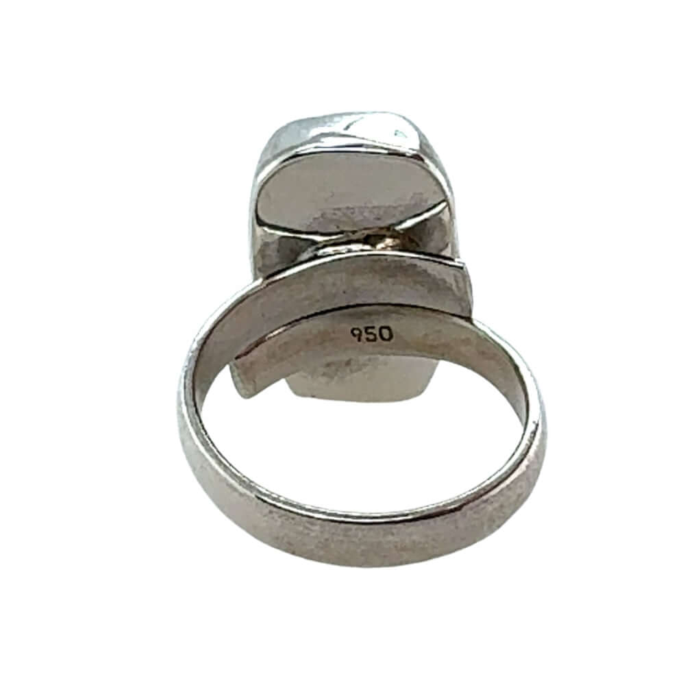 Silver ring with a unique design on a white background