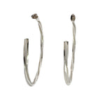 Pair of silver hoop earrings on a white background