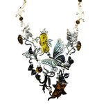 Ornate necklace with butterfly and floral design on a white background
