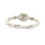Silver twisted ring on a white background