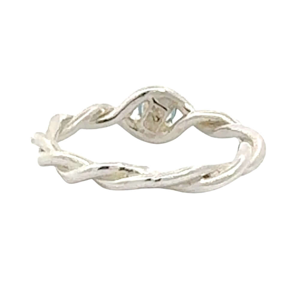 Silver twisted ring on a white background