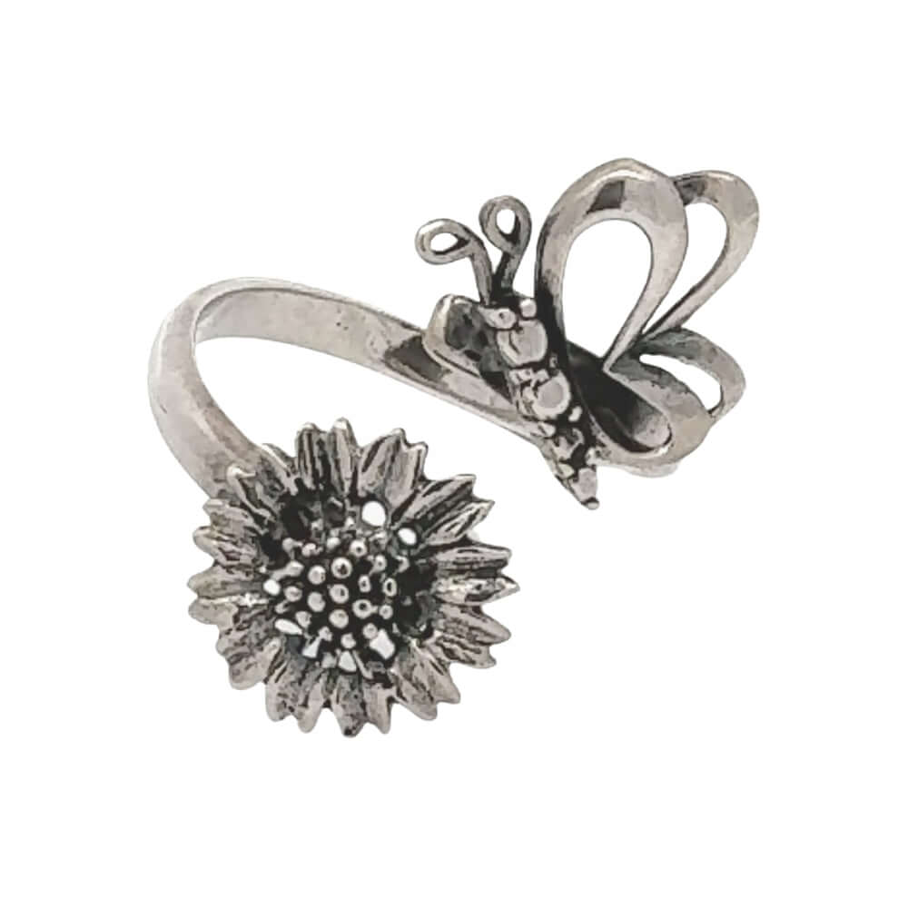 Silver ring with butterfly and sunflower design on a white background