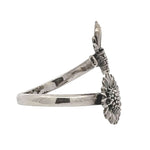 Silver ring with a unique design on a white background