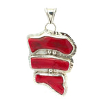Red coral pendant with silver setting on a white background
