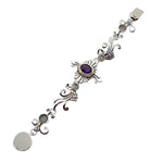 Silver bracelet with amethyst on a white background