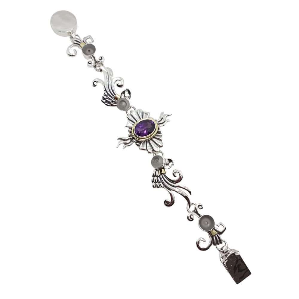 Decorative silver bracelet with purple gemstone on a white background
