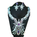 950 silver jewelry set with necklace and earrings on a black stand