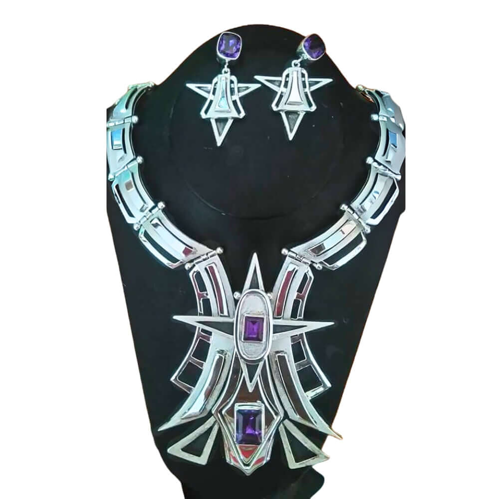 950 silver jewelry set with necklace and earrings on a black stand