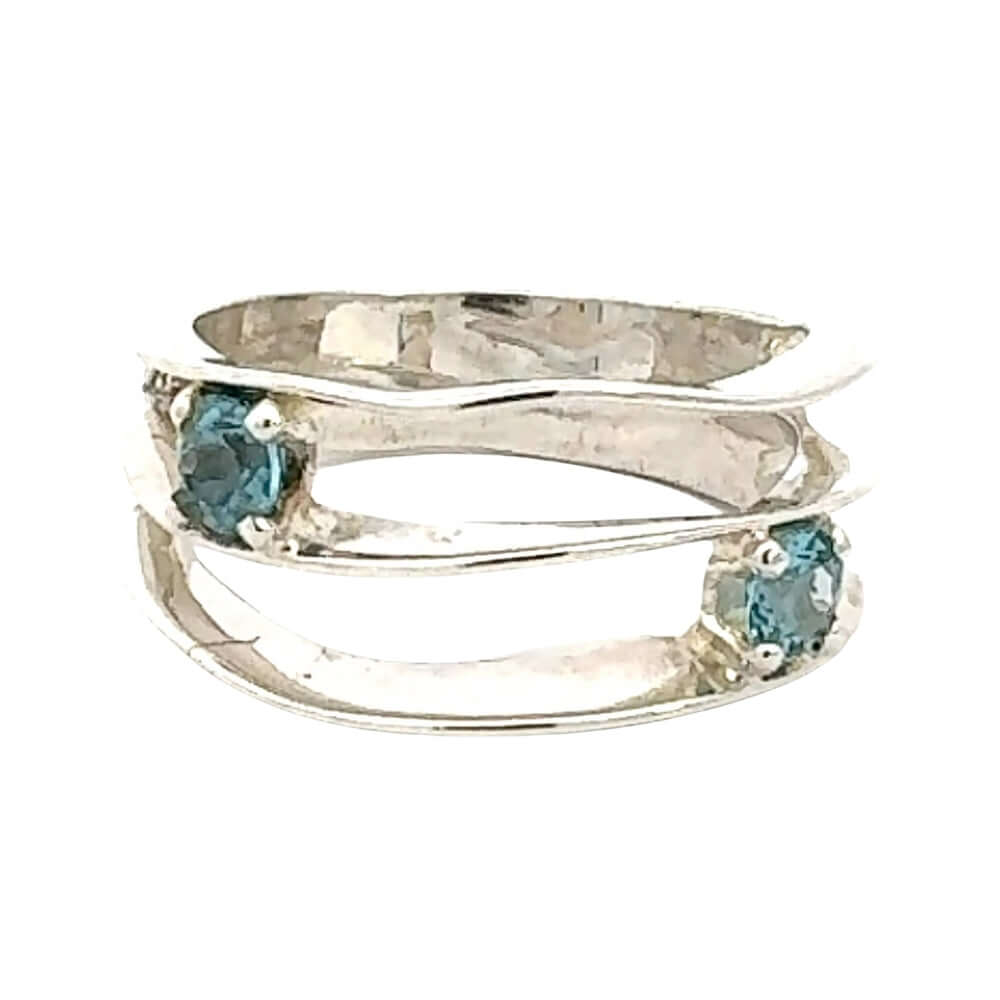 Silver ring with two blue topaz gemstones on a white background frontal view