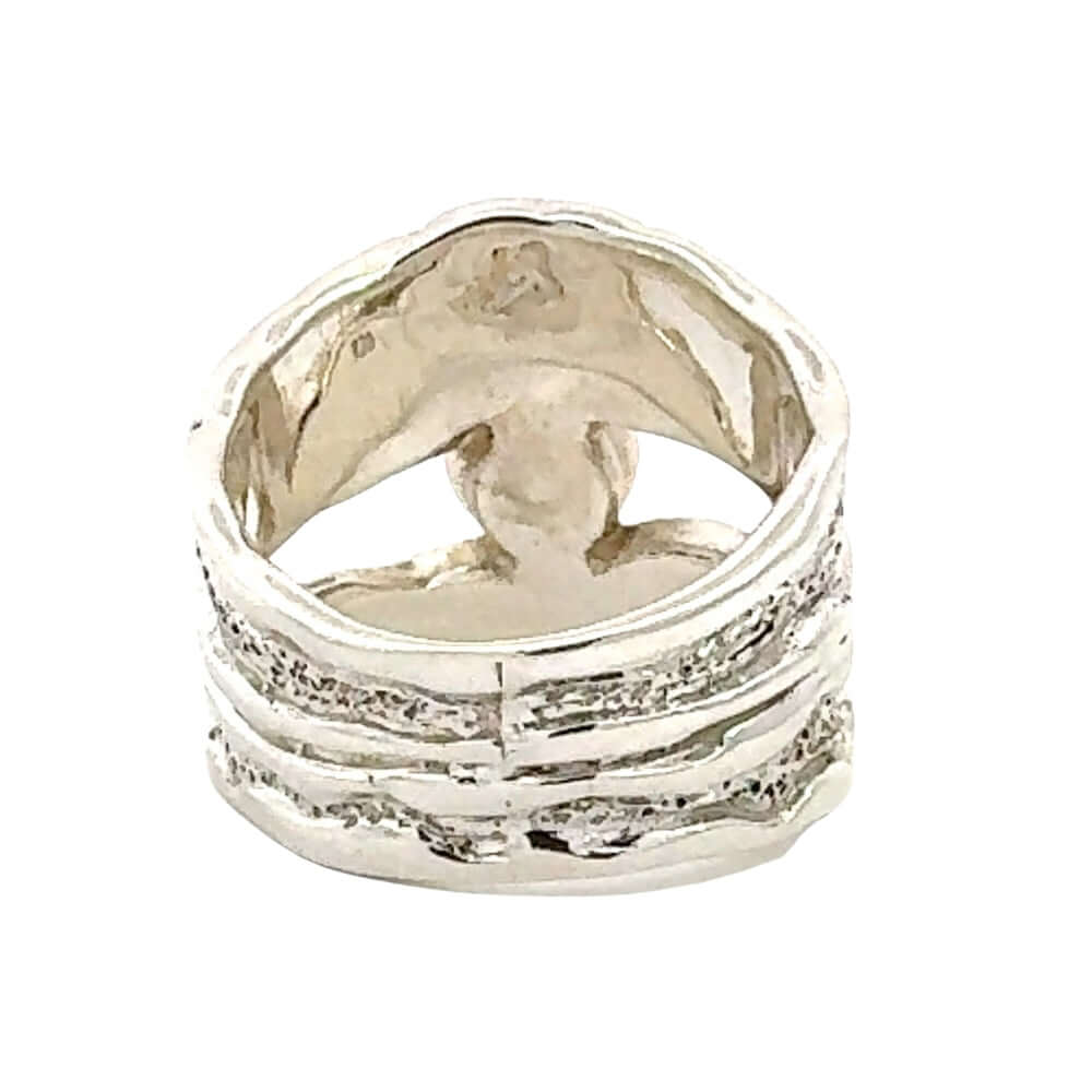 Taxco Silver ring with textured design on a white background