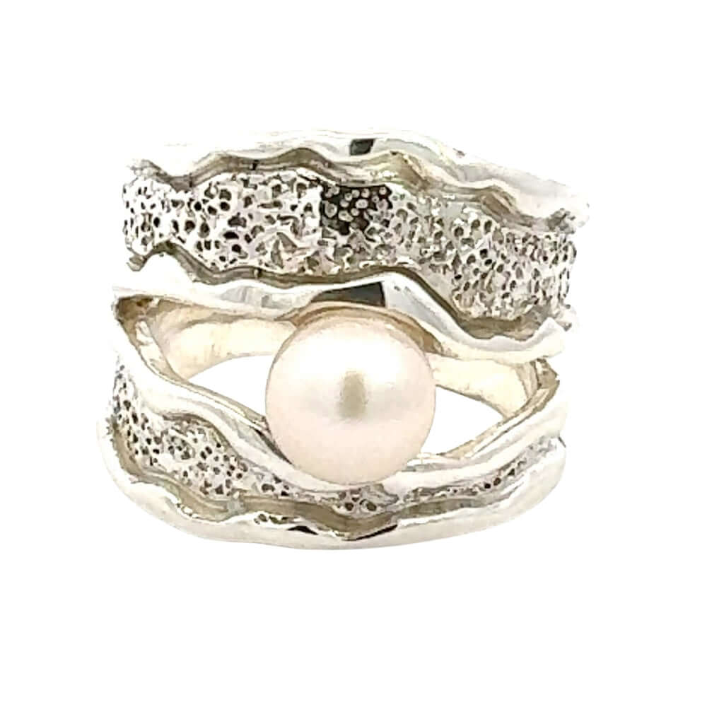 Taxco Silver ring with a pearl on a white background