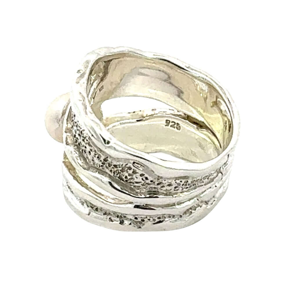 Taxco Silver ring with textured design on a white background
