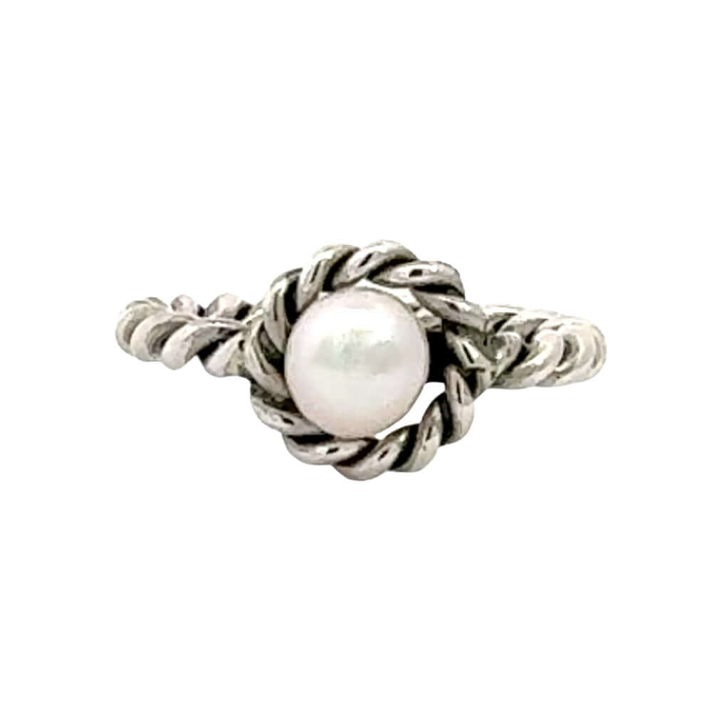 Silver ring with a pearl on a white background