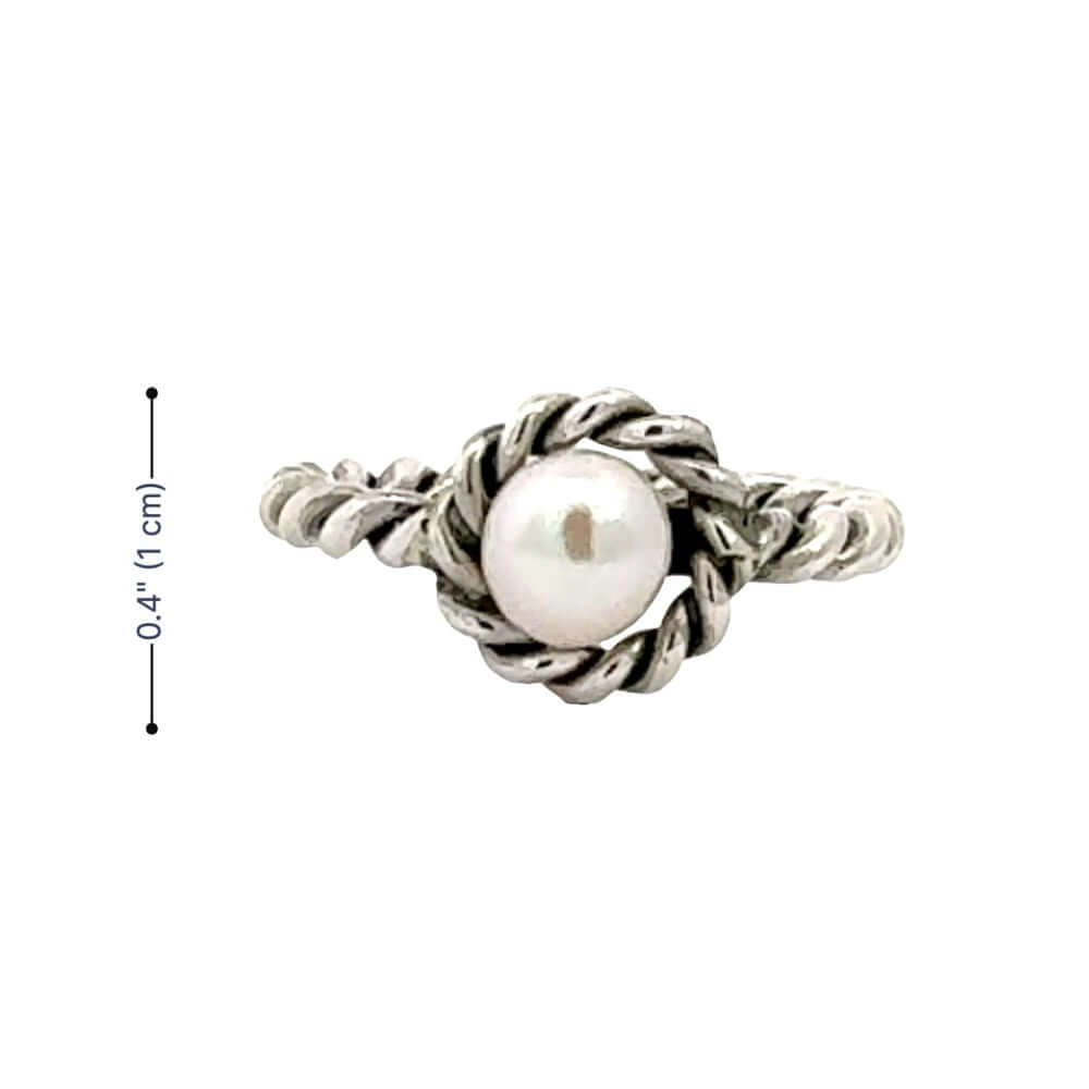 Silver ring with a pearl on a white background and measurements