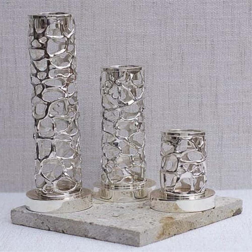 Sterling silver candleholder “Fibras” by Alejandro Fajardo with intricate pierced and embossed design, showcasing expert Taxco silversmith craftsmanship.