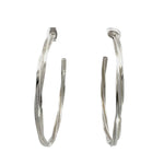 Pair of silver hoop earrings on a white background