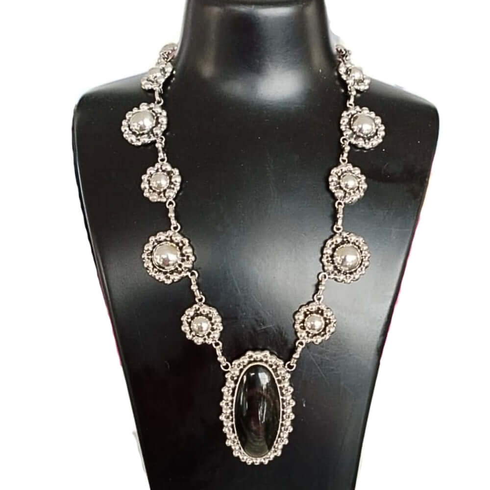 Sterling silver necklace with obsidian and sunflower details, handmade by master silversmith Alejandro Fajardo from Taxco