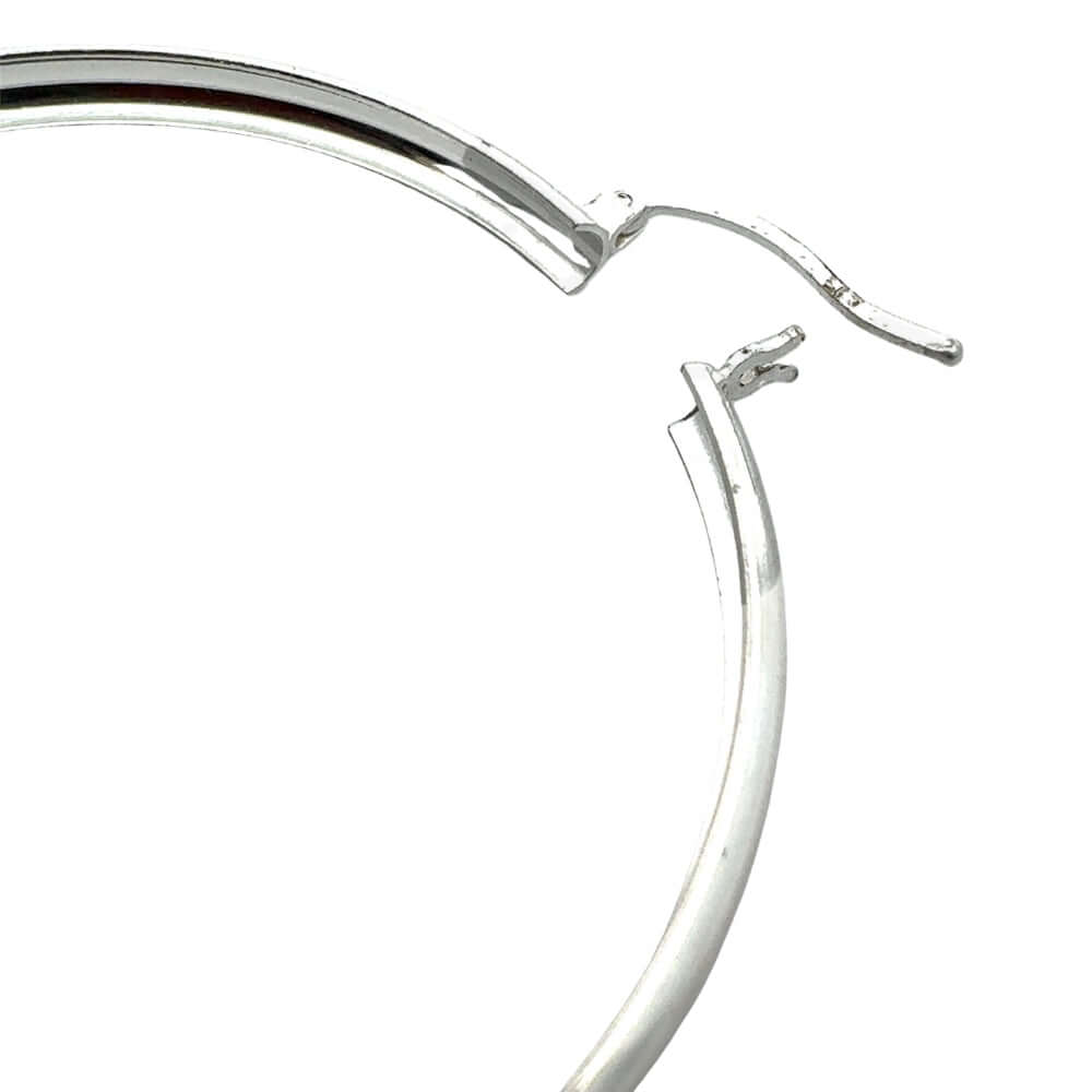 Silver hoop earring on a white background