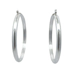 Pair of silver hoop earrings on a white background