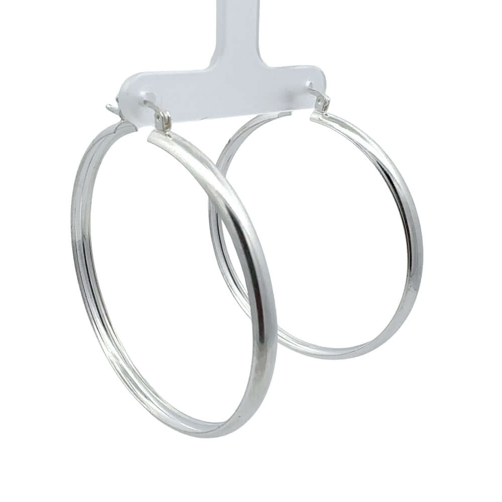 Silver hoop earrings on a white background