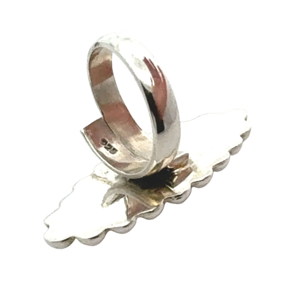Silver ring with a unique design on a white background
