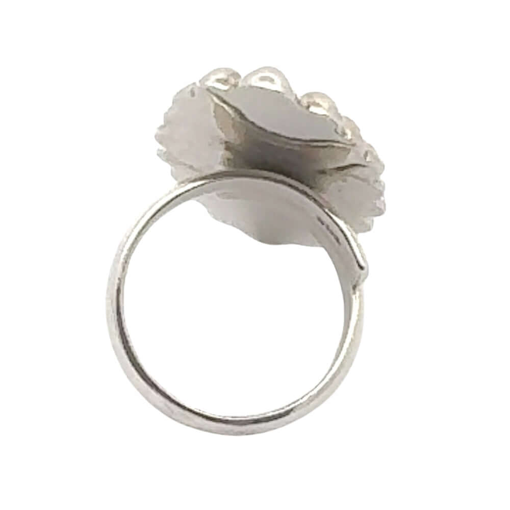 Silver ring with a decorative element on a white background
