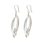 Pair of silver leaf-shaped earrings on a white background