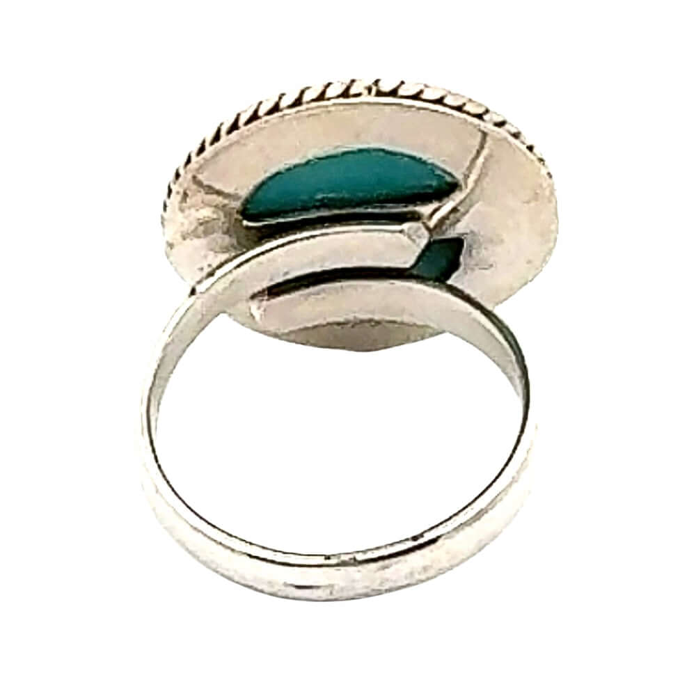 Silver ring with turquoise stone on a white background