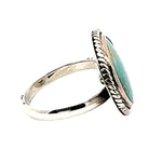 Silver ring with turquoise stone on a white background, other side